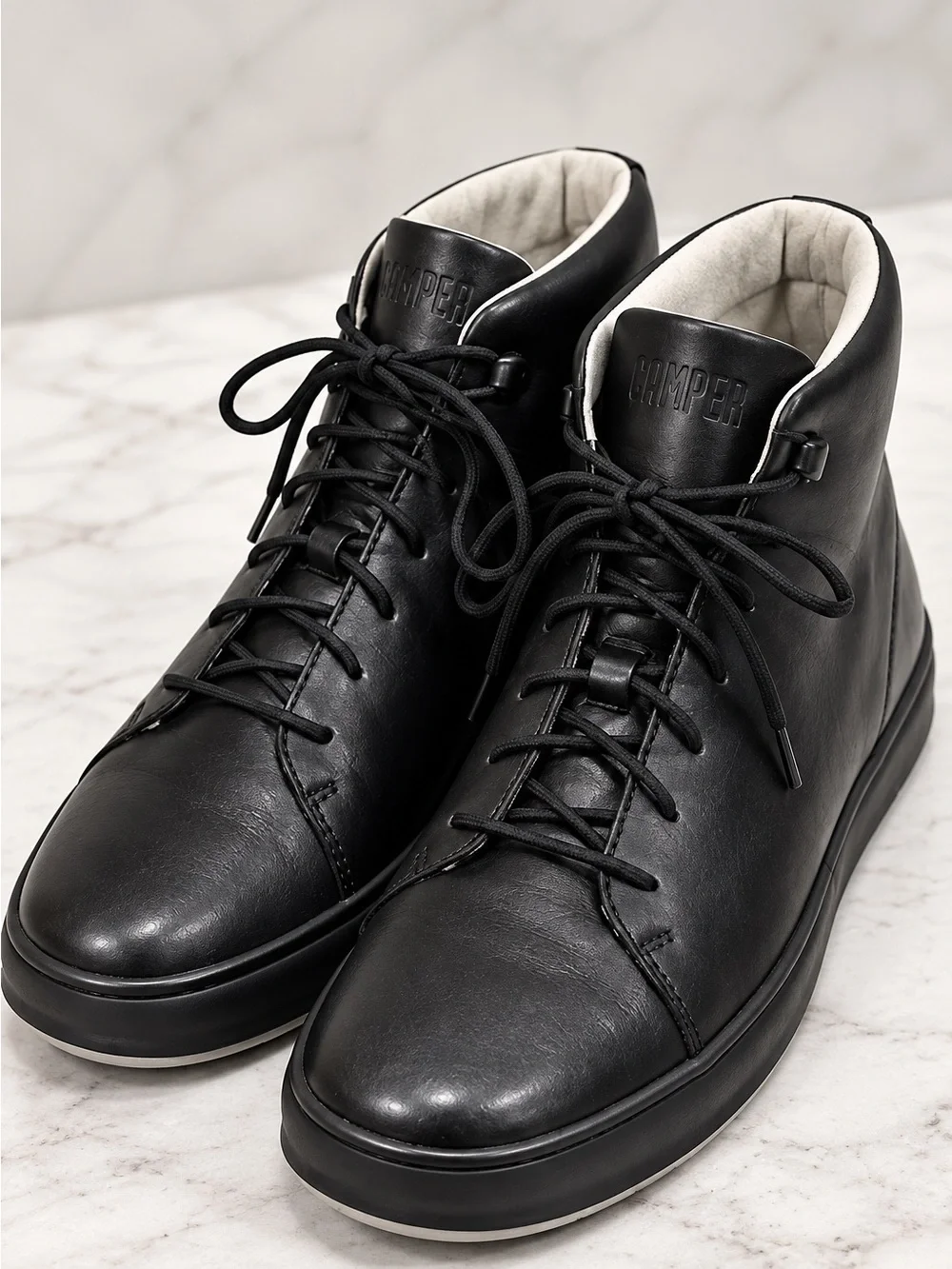 Camper Chasis men’s high-top sneakers / ankle boots in classic black leather.